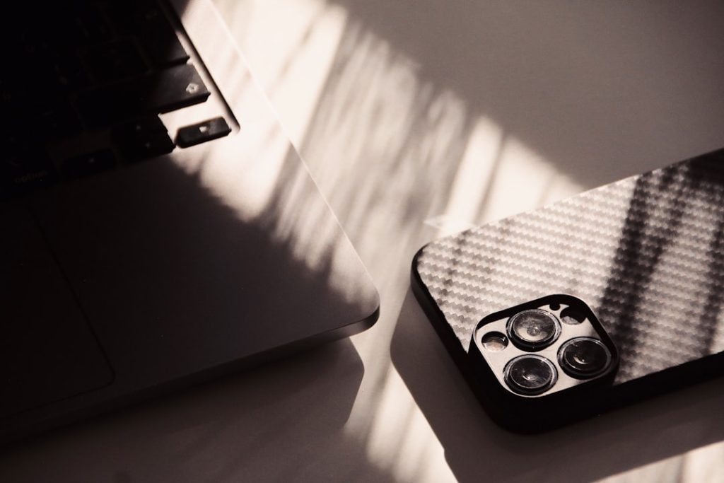 a-laptop-computer-sitting-on-top-of-a-white-table-jebuvtgu9uq